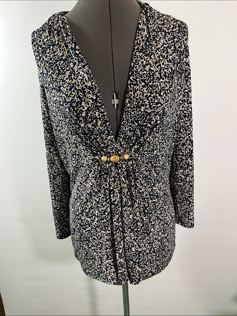 Long Sleeve Navy and Cream V-Neck Top Features Decorative beaded cinched detail